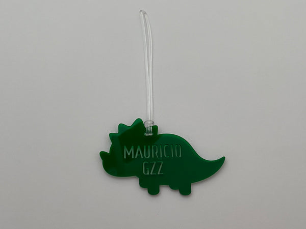 Tag dinosaurio con letras perforadas